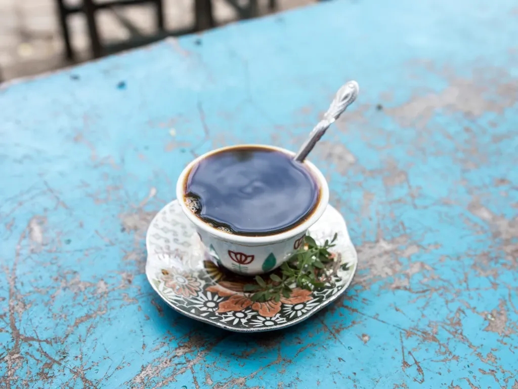 A cup of coffee sits on a table